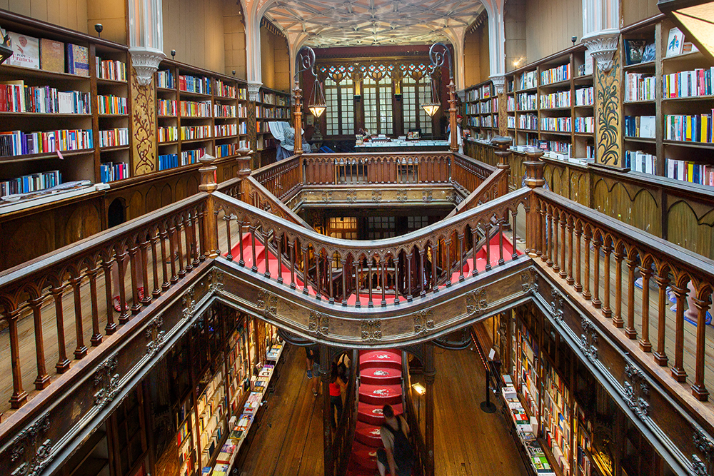 Interior of Livraria Lello bookstore in Porto, Portugal, featuring its ornate staircase and carved wooden details