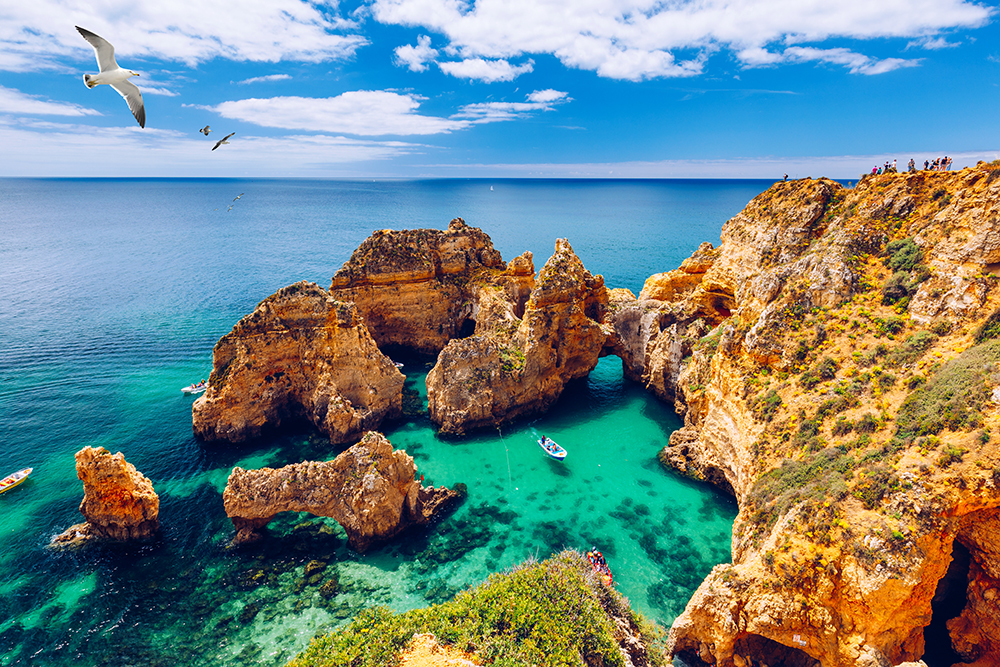  Panoramic view of Ponta da Piedade cliffs near Lagos in the Algarve, Portugal, with dramatic rock formations and turquoise ocean