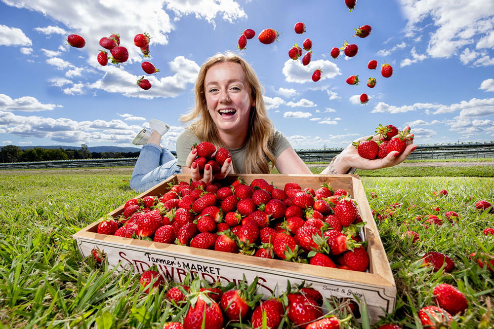 Young woman with strawberries.