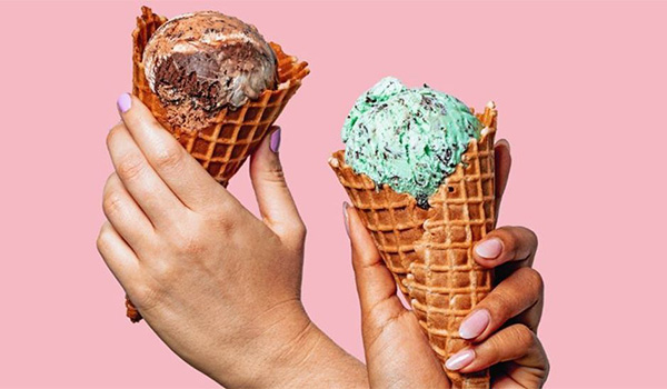 Hands holding ice cream cones