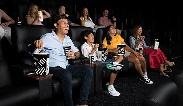family watching movie in theatre